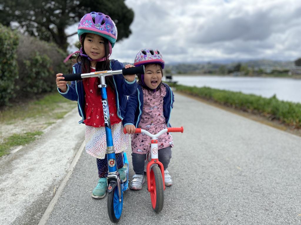 We ride lots of things now. Kayli got a new scooter and Meimei learned to ride a balance bike!